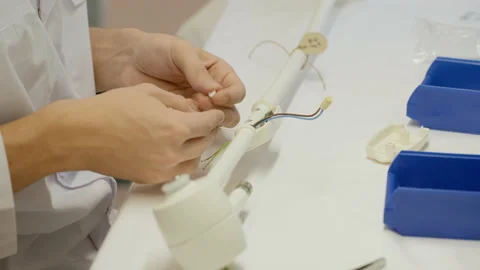 Hands Of Operator In Close Up. Fixing Wires In Base. Medical Lamps Assembly. Stock Footage 220891631
