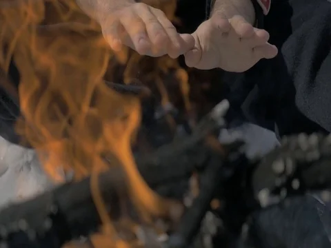Hands over fire Video stock 77661043