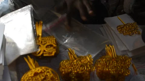 Hands packaging acrylic products in a small manufacturing workshop 動画素材 326932205