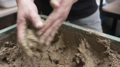Hands Packing Damp Soil into a Rounded Ball Shape Stock Footage 340901053