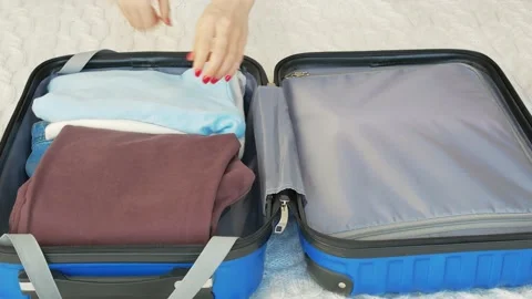 Hands packing for the summer holidays after the coronavirus pandemic. Lastly Stock Footage 147067935
