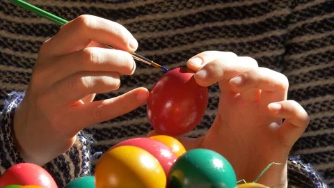Hands paint Easter eggs Stock Footage 83547809