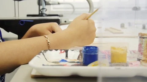 The hands of the painter are painted Stock Footage 79491540
