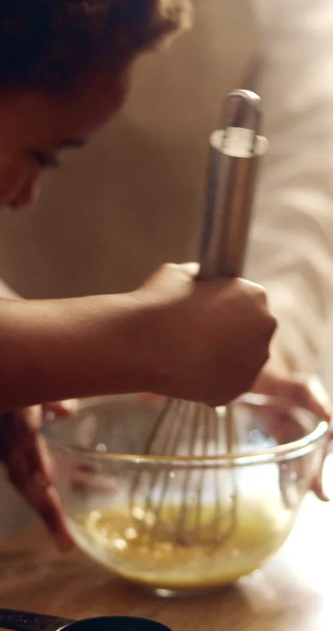 Hands, parent and child with mixing for baking, cake process and teaching family Stock Footage 339047680