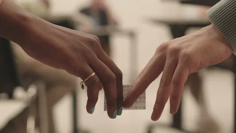 Hands Passing Over Cheat Sheet Video stock 153208181