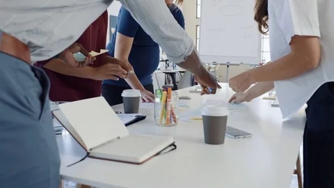 Hands pasting post it notes part of creative brainstorming session meeting Stock Footage 73223404