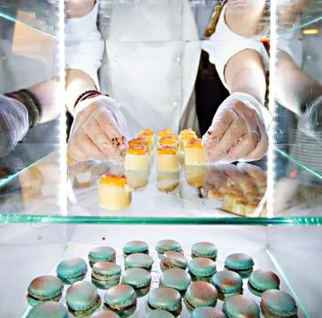 Hands of a pastry chef Stock Photos