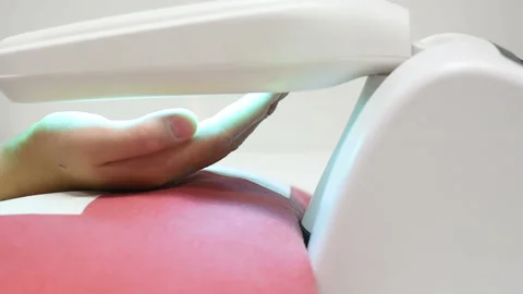 Hands of a patient with psoriasis close-up under an ultraviolet lamp. Stock Footage 100606916