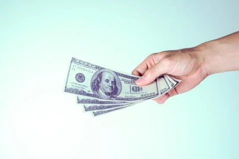 Hands paying dollars Stock Photos