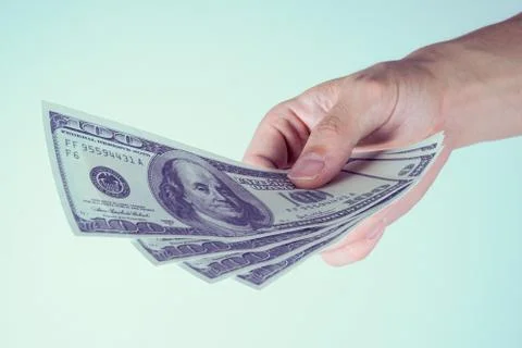 Hands paying dollars Stock Photos