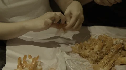 Hands Peeling Fresh Prawns at Table in Sunshine Coast Queensland Australia Stock Footage 341312660