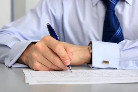 Hands with a pen Fotos de archivo