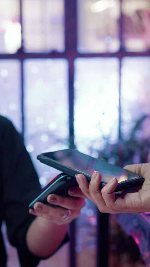 Hands, people and phone payment in shop for tap transaction, pos machine and Stock Footage 338064682