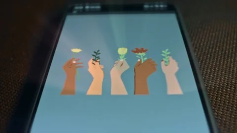 Hands of people of different nations hold flowers, unity and peace concept Stock Footage 309459960