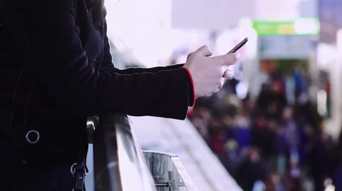 Hands of people using smartphone with crowd in background Stock Footage 49817516