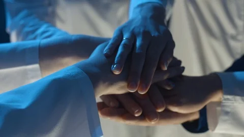 Hands of people in white clothes get together Video stock 101013636