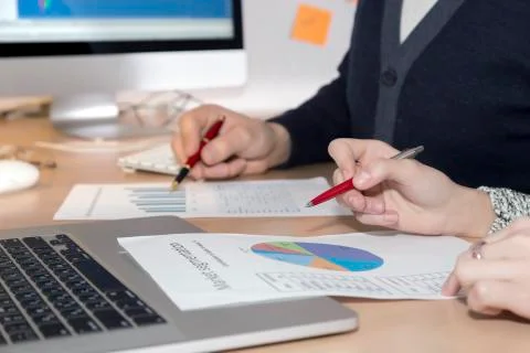 Hands of people working on presentation Stock Photos