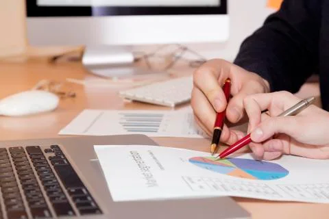 Hands of people working on presentation Stock Photos