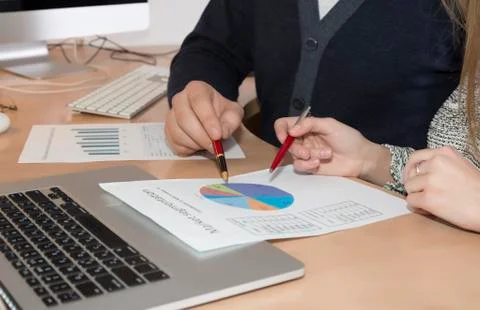 Hands of people working on presentation Stock Photos