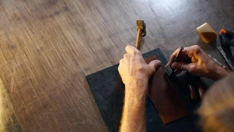 Hands performs work on table. Stock Photos