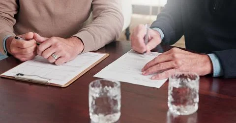 Hands, person and writing on document with advisor, finance report and form.. Stock Photos