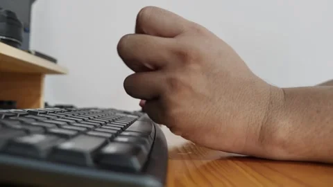 Hands of a person feeling pain getting injured when typing on keyboard. De .. Stock Footage 280950490