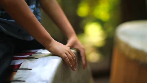 Hands of a person playing a drum in a drum circle. Stock Footage 88405368