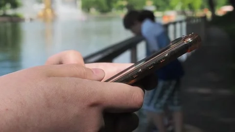 The hands of the person using the phone. Close-up Stock Footage 238442915