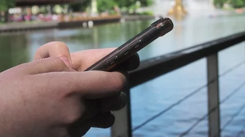 The hands of the person using the phone. Close-up Video stock 238442923