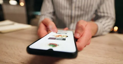 Hands, phone and man scroll on menu with online restaurant order for dinner Stock Footage 277051736