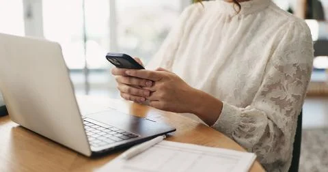 Hands, phone and texting with remote work from home with laptop, documents .. Stock Photos