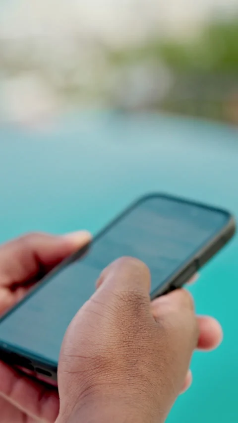 Hands, phone and vacation with pool for travel, weekend and scroll break. Hotel, Stock Footage 332913046