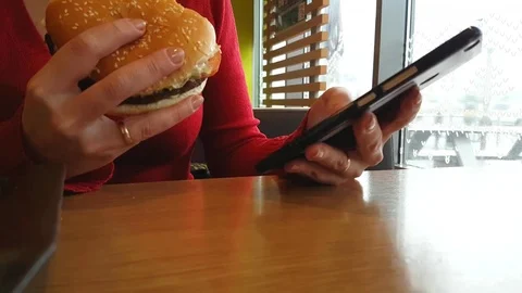Hands phone burger cafe Stock Footage 83200175