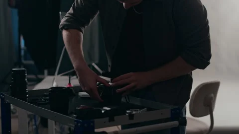 Hands of Photographer Attaching Lens before Studio Photo Shooting Video stock 309919086
