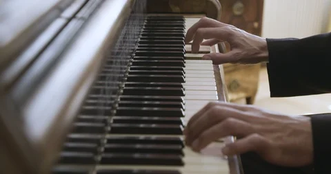 Hands at the piano keys Stockbeeldmateriaal 97522652