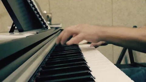 Hands on the piano roll close-up Stock Footage 69167127