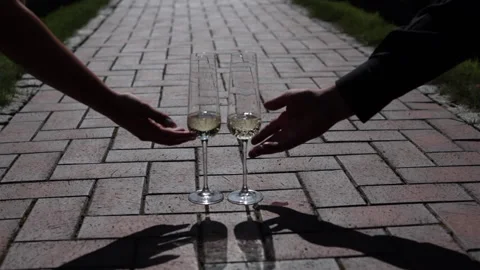 Hands pick up glasses of champagne Stock Footage 144315310