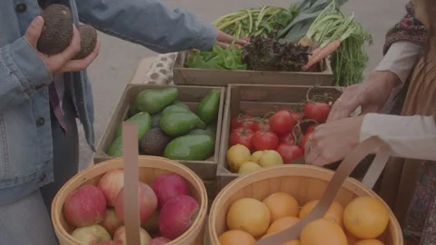 Hands Picking Produce Out Of Baskets Stock Footage 270333852