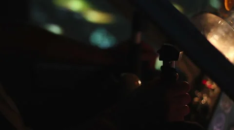 Hands of pilot on steering wheel navigating flight over illuminated night city Stock-Footage 68696152