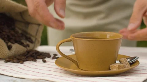 Hands placing a cup of coffee Stock Footage 141601494