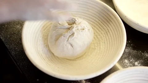 Hands Placing Dough in Floured Proofing Basket, Craft Bakery, Overhead Shot 動画素材 341347017