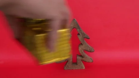 Hands placing many gifts packed in colourful paper under a wooden old Christmas  Stock Footage 70554124