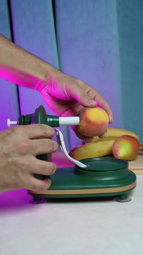 Hands Placing Peach On Rotary Fruit Peeler Stock Footage 345348479