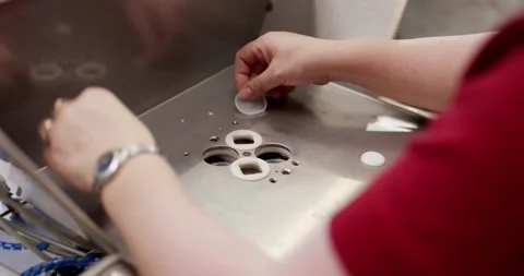 Hands Placing Round Sealing Rings, Machine Fixture Assembly, Close Up Shot Видео 340650575