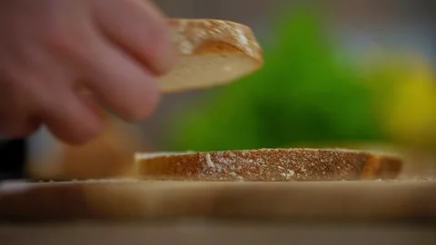 Hands Placing Sliced Fresh Bread on Wooden Surface Stock Footage 340483292
