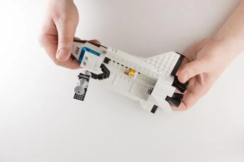 Hands with plastick brick Stock Photos