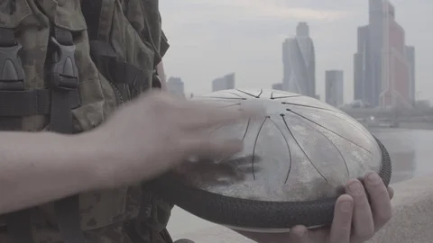 Hands play on hapi drum on waterfront Video stock 89081857