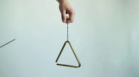 Hands play a musical triangle. Hit a few times Vídeos de archivo 59643817
