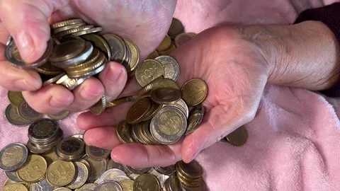 Hands play with pile of coins Video stock 223511231