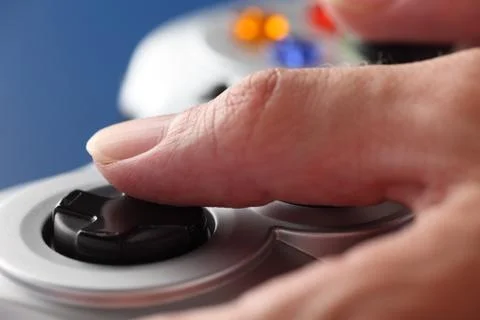 Hands play video game using a gamepad Stock Photos